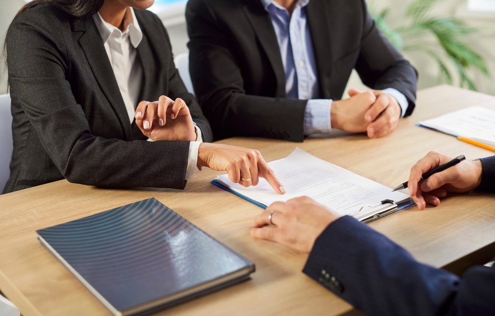 Couple discussing mortgage assumption options during a divorce consultation