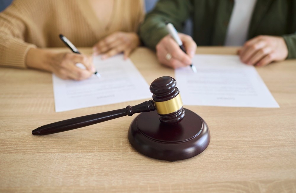Signing mortgage and property documents as part of an Arizona divorce settlement