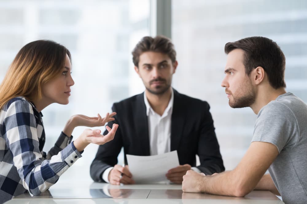 Getting a divorce. A man and woman consulting a lawyer about the divorce procedure.