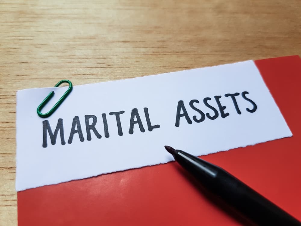 Marital assets written on table background