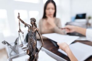 A couple argues during a visit to a lawyer to finalize their divorce agreement, while the lawyer prepares the documents.