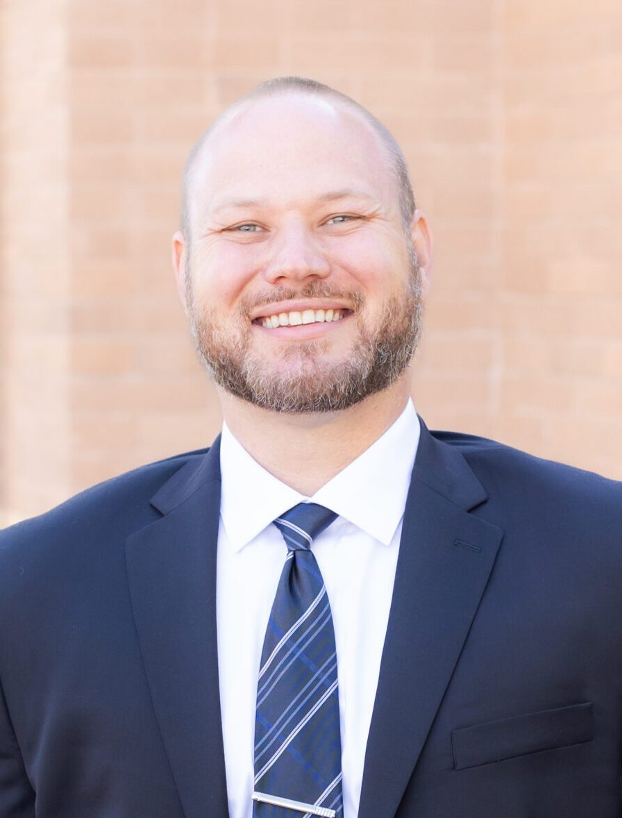 Portrait of Justin Tash, CEO and Founding Partner.